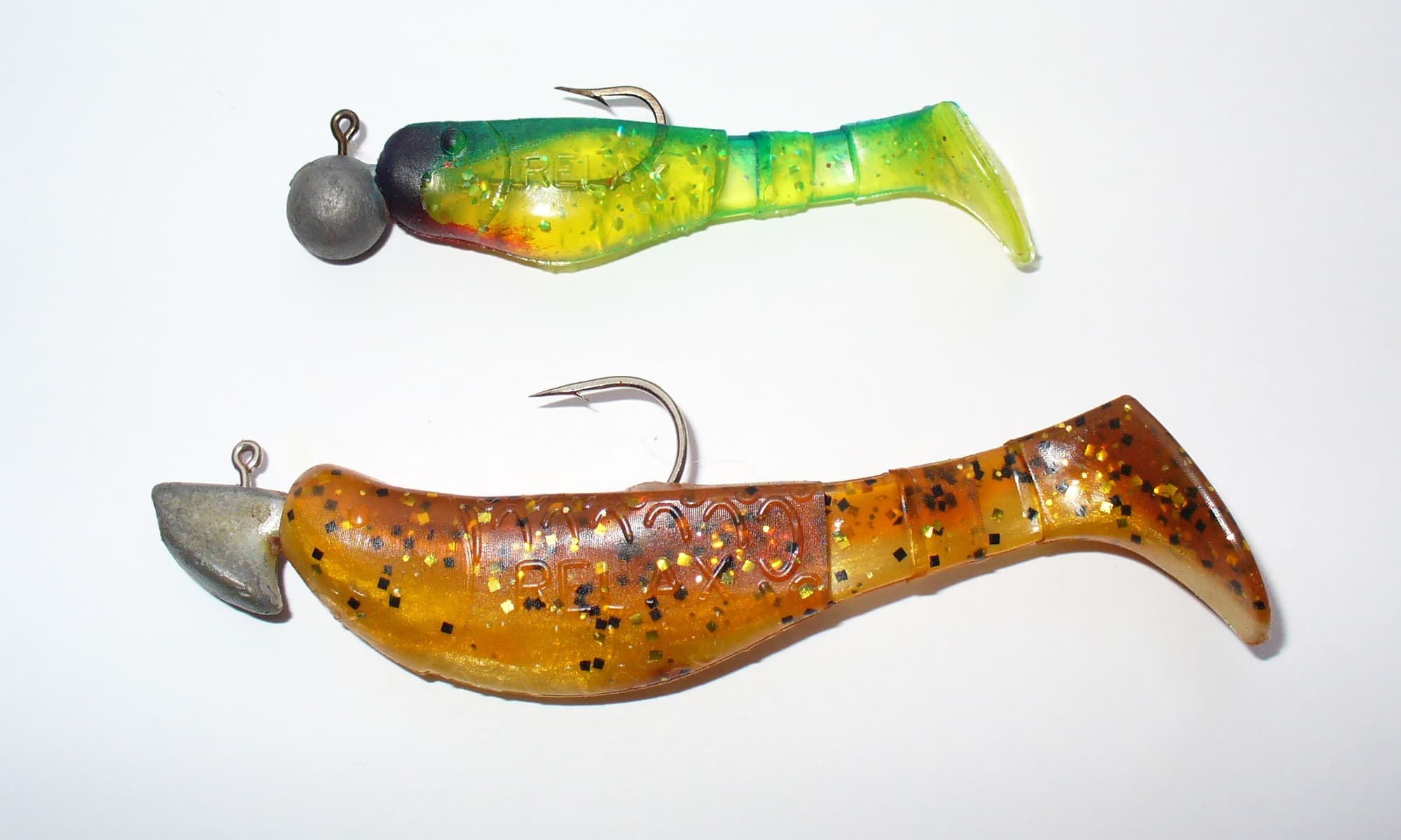 Soft plastic twister lures on white background